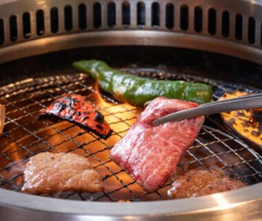 Beef slices and vegetables grilling on a tabletop yakiniku at Ryokan Gizan in Gifu, Chūbu