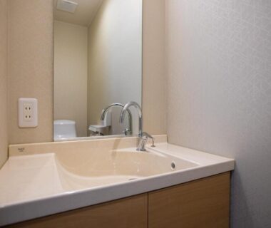 Sink and mirror in a bathroom at Ryokan Hitaya in Ōita, Kyūshū, Japan