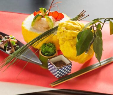 Plated Japanese appetizers with chopsticks at Ryokan KANADE in Kyoto, Kansai
