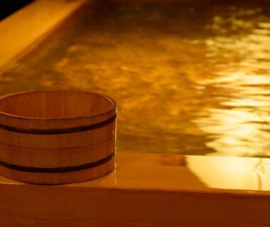 Wooden soaking bucket on edge of warm bath at Ryokan Kohro in Kyoto