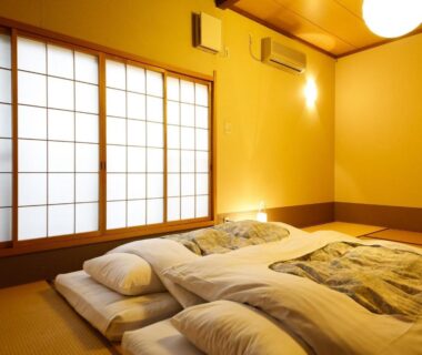 Tatami room with futons and shoji screens at Ryokan Kutsuroginoya Yuu, Gifu, Chūbu, Japan