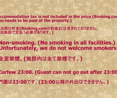 Bilingual policy card detailing tax, no smoking and 23:00 curfew at Ryokan Kyoraku Kyoto