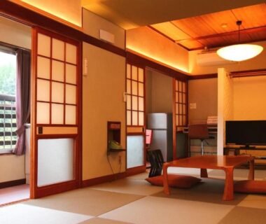 Tatami room with low table and shoji screens at Ryokan Maruya, Ōita, Kyūshū