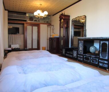 Futon bedding on floor in guest room with wooden furnishings, Ryokan Matsukaze, Nagano