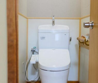 Compact modern toilet with bidet controls in Ryokan Matsushima guest restroom, Kanagawa, Kantō, Japan