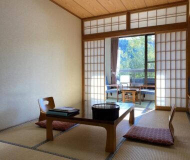 Tatami room with low table, shoji screens and veranda seating at Ryokan Misato in Kumamoto, Kyūshū