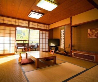 Traditional tatami room with low table and shoji screens, Ryokan Misato, Kumamoto, Kyushu, Japan