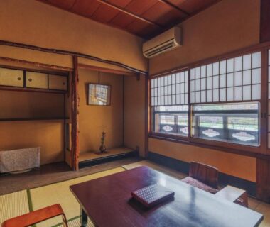 Tatami room with low table and shoji screens at Ryokan Motonago in Kyoto Kansai