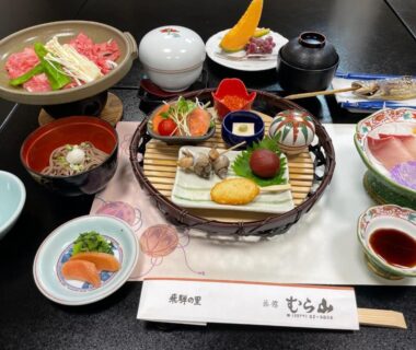 Assorted traditional Japanese dishes and lacquerware set for a ryokan dinner at Ryokan Murayama, Gifu, Chūbu