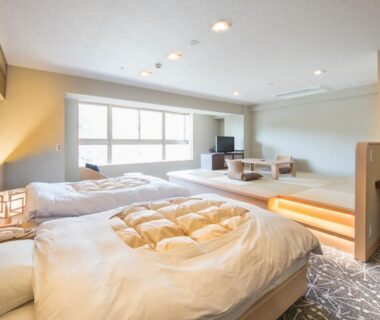 Bright twin bedroom with raised seating area at Ryokan Nenrinbo, Kyoto, Kansai, Japan