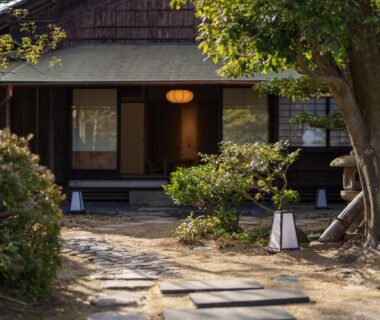 Stone pathway and lanterns leading to the ryokan entrance at Onomichi Nishiyama in Hiroshima