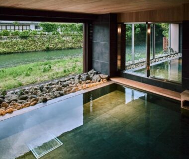 Indoor onsen bath with river view at Ryokan Oomuraya in Saga, Kyūshū