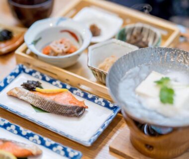 Traditional Japanese breakfast with grilled fish and tofu at Ryokan Ryokufuso in Kyoto