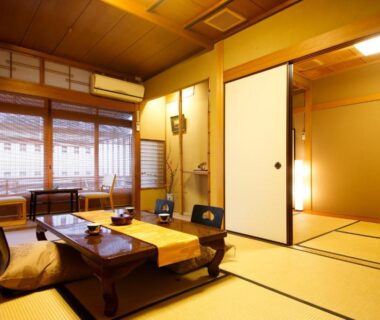 Tatami room with low table and shoji screens at Ryokan Sanga, Kyoto, Kansai, Japan
