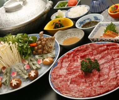 Thinly sliced beef, assorted mushrooms and vegetables with hot pot setup at Ryokan Sanoya Kyoto