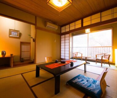 Traditional tatami room with low table and shoji screens at Ryokan Seishounagon in Mie, Kansai