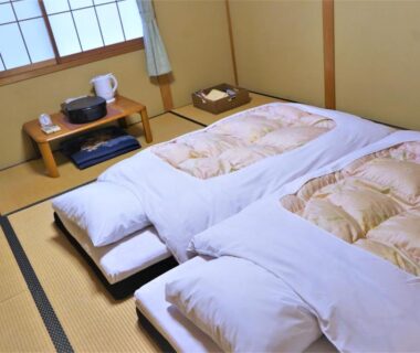 Two futons on tatami floor at Ryokan Shimizu in Kyoto