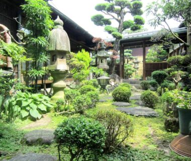 Stone lantern and moss garden with stepping stones at Ryokan Taishoro in Nara Kansai