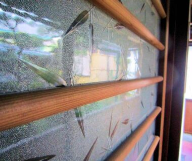 Frosted patterned glass with wooden horizontal slats in a Ryokan Taishoro interior corridor, Nara