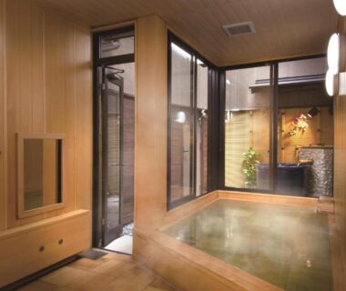 Indoor wooden hot spring bath with courtyard garden view at Ryokan Tanabe, Gifu, Chūbu, Japan