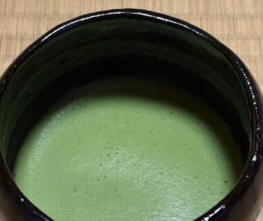 Ceramic bowl of matcha on tatami at Ryokan Tori in Kyoto