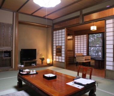 Tatami room with low wooden table and shoji screens at Ryokan Wakaba, Kumamoto Kyushu