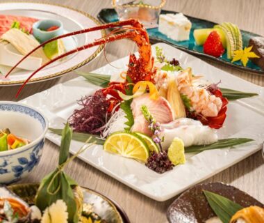 Assorted sashimi and Japanese side dishes arranged on table at Ryotei Tanokura, Ōita