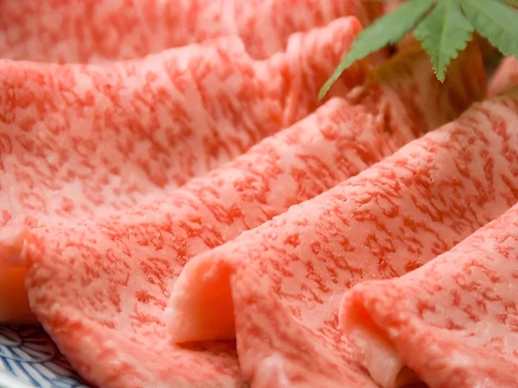 Marbled beef slices at Ryoufuso Mie Thin marbled beef slices on a plate at Ryoufuso in Mie, Kansai
