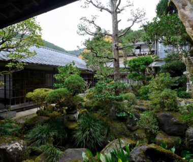 Manicured courtyard garden with mossy rocks at Ryouriryokan Asahikan in Nara