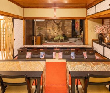 Tatami seating area with low tables and cushions at SAKURA inn 白米 in Yamanashi, Chūbu Japan