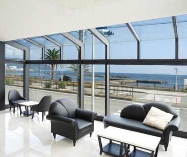 Glass-walled lounge seating with sea view at SEVEN SEAS HOTEL ITO Shizuoka Chūbu