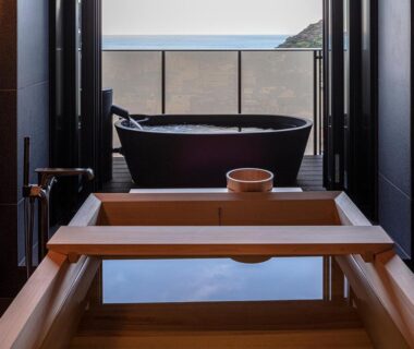 Indoor wooden soaking tub with balcony freestanding bathtub overlooking sea at SOKI ATAMI in Shizuoka, Chūbu Japan