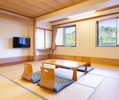 Tatami room with low table and zabuton cushions at Sachinoyu Hotel Shiga Kogen in Nagano, Chūbu