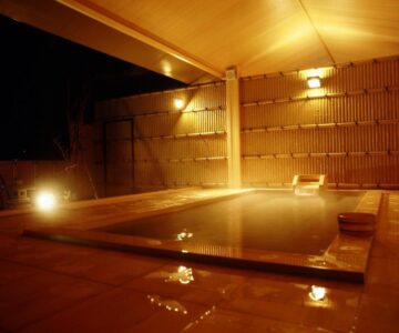 Warm indoor onsen with wooden interior at Sakaeya Hotel in Yamagata, Tōhoku