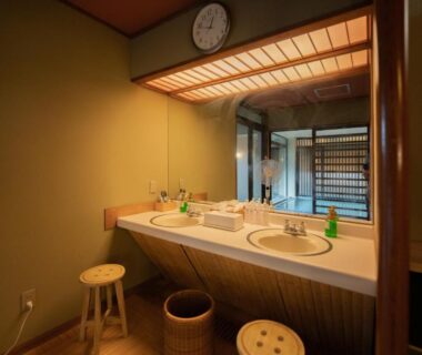 Dual sinks with mirrors, wooden stools and shoji screens in Sakahijiri Nikko washroom, Kantō region, Japan