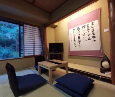 Tatami room with low table, shoji screens and garden view at Sakahijiri Nikko, Tochigi