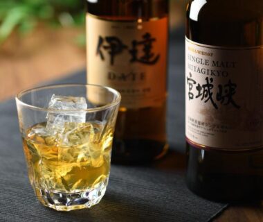 Glass of whisky with ice beside Japanese whisky bottles at Sakunami Onsen Yuzukushi Salon Ichinobo, Miyagi Tōhoku