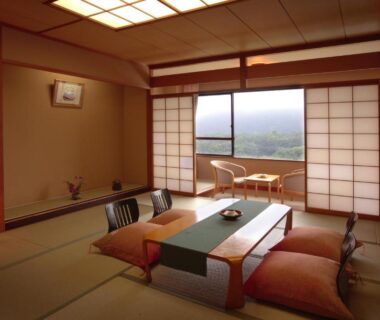 Tatami room with low table, cushions and shoji screens at Sansatei in Miyagi Tōhoku