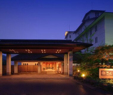 Twilight lit ryokan entrance with covered driveway, Sansatei in Miyagi Tōhoku Japan