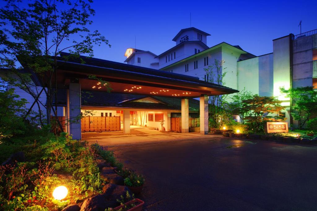 Illuminated entrance Sansatei Miyagi Tohoku Japan Lit entrance canopy and lanterns at Sansatei in Miyagi Tohoku, showing driveway and illuminated facade at dusk