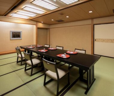 Low dining table with chairs in tatami room at Sansuikan Kinryu, Shizuoka, Chūbu, Japan