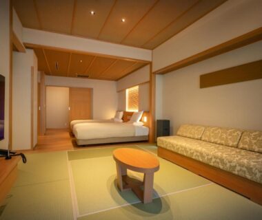 Tatami area with Western beds and sofa in Sansuiso Tsuchiyu Spa ryokan room, Fukushima, Tōhoku, Japan