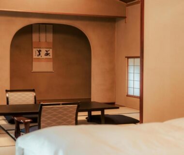 Tatami room with low table, shoji screens and bedding at Sanyo-so in Shizuoka, Chūbu Japan