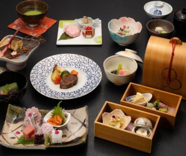 Assorted traditional Japanese course dishes on lacquered tableware at Sanyo-so ryokan in Shizuoka, Chūbu