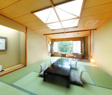 Tatami room with low table and floor cushions at Sasakura onsen Ryuunso, Niigata, Chūbu, Japan