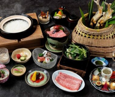 Multi-course Japanese table setting with assorted small dishes and grilled skewers at Sasara in Gifu, Chūbu