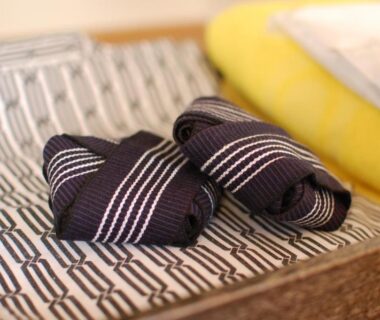 Striped fabric slippers on patterned tray at Sawatari Onsen Miyataya Ryokan, Gunma