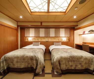 Tatami room with twin beds and wooden accents at Seifutei in Fukushima, Tōhoku