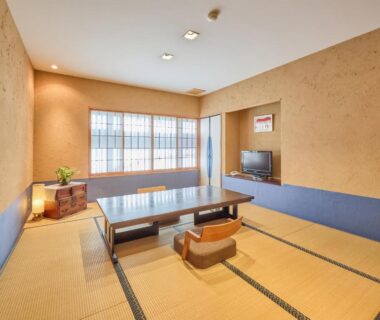 Tatami room with low table, shoji screens and floor chairs at Seikansou in Kanagawa, Kanto, Japan