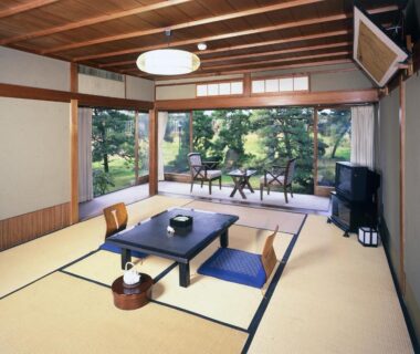 Traditional tatami room with low table and garden view at Seikiro Ryokan in Kyoto